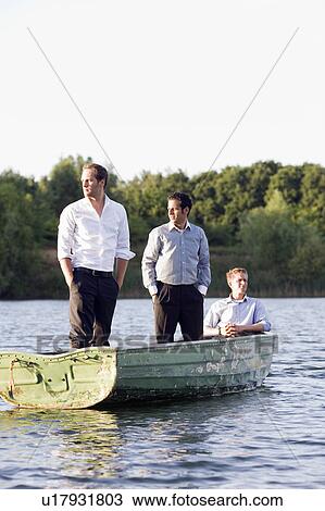 three businessmen in rowboat View Large Photo Image Stock Image - three businessmen in rowboat. Fotosearch