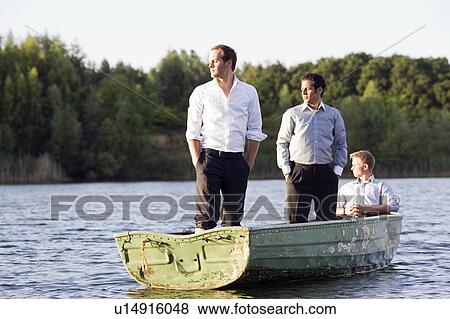 three businessmen in rowboat View Large Photo Image Stock Photo - three businessmen in rowboat. Fotosearch
