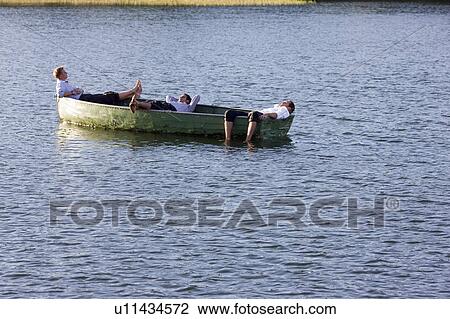 three businessmen relaxing in rowboat View Large Photo Image Stock Image - three businessmen relaxing in rowboat. Fotosearch