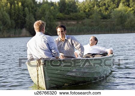 three businessmen relaxing in rowboat View Large Photo Image Stock Image - three businessmen relaxing in rowboat. Fotosearch