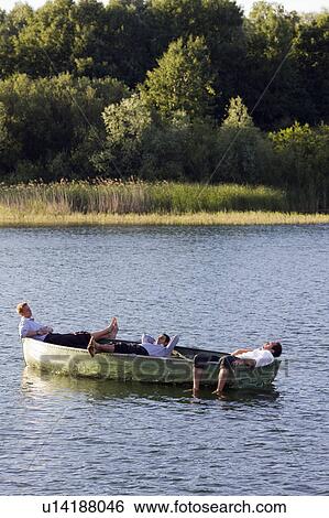 three businessmen relaxing in rowboat View Large Photo Image Stock Photograph - three businessmen relaxing in rowboat. Fotosearch