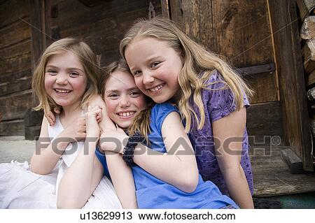Stock Image - Three girls smiling.. Fotosearch