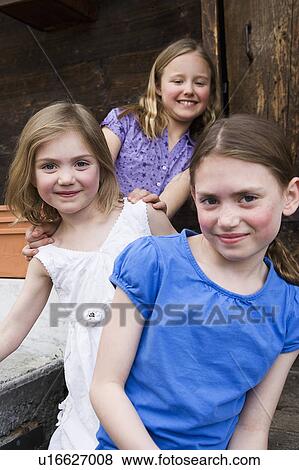 Stock Photo - Three girls smiling.. Fotosearch