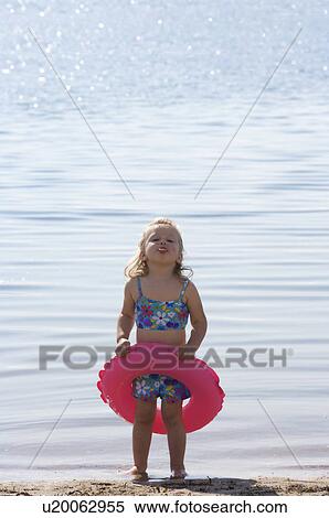 Toddler on the beach View Large Photo Image Stock Photography - Toddler on the beach. Fotosearch