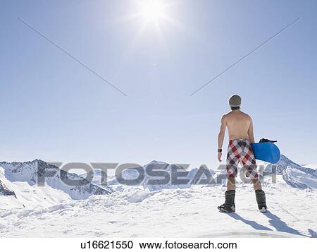 Stock Image - topless man with snowboard. Fotosearch