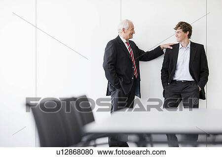 two businessmen in meeting room View Large Photo Image Stock Image - two businessmen in meeting room. Fotosearch