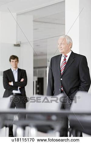 two businessmen in meeting room View Large Photo Image Stock Image - two businessmen in meeting room. Fotosearch