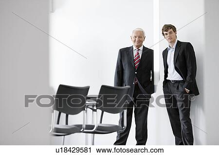 two businessmen in meeting room View Large Photo Image Stock Image - two businessmen in meeting room. Fotosearch