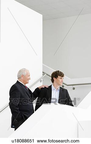 two businessmen on staircase View Large Photo Image Stock Image - two businessmen on staircase. Fotosearch