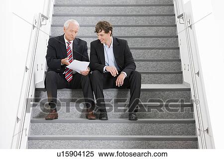 two businessmen on staircase View Large Photo Image Stock Photography - two businessmen on staircase. Fotosearch
