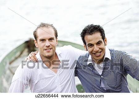 two businessmen sitting wet in rowboat View Large Photo Image Picture - two businessmen sitting wet in rowboat. Fotosearch
