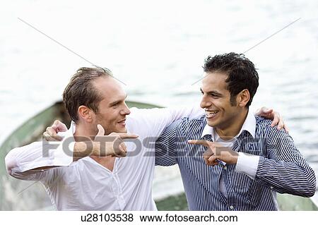 two businessmen sitting wet in rowboat View Large Photo Image Stock Photo - two businessmen sitting wet in rowboat. Fotosearch