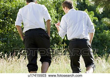 two businessmen talking in field View Large Photo Image Stock Image - two businessmen talking in field. Fotosearch