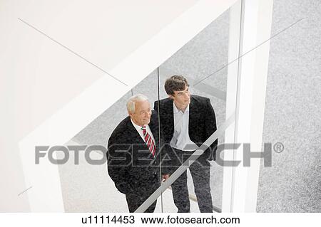 two businessmen talking View Large Photo Image Stock Image - two businessmen talking. Fotosearch