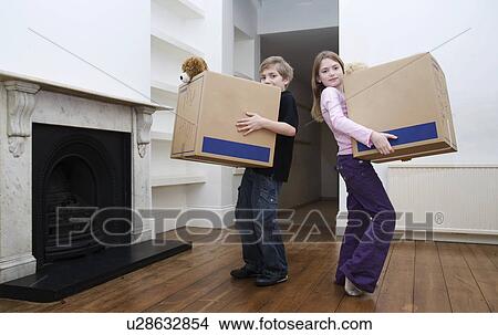 Picture - Two children holding boxes. Fotosearch