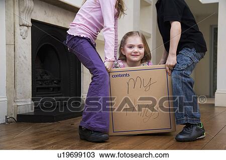 Stock Image - Two children lifting another child. Fotosearch