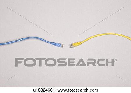 Stock Image - Two ethernet cables meeting. Fotosearch