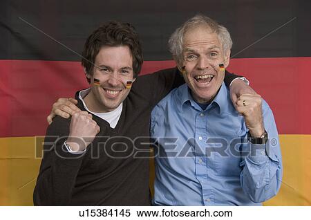 Two males smiling with German flag View Large Photo Image Stock Photography - Two males smiling with German flag. Fotosearch