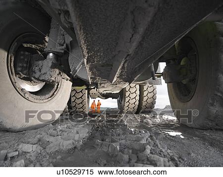 Stock Photography - View Of Coal Miners From Under Truck. Fotosearch