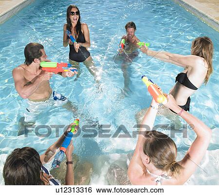 water fight between young people View Large Photo Image Stock Photograph - water fight between young people. Fotosearch