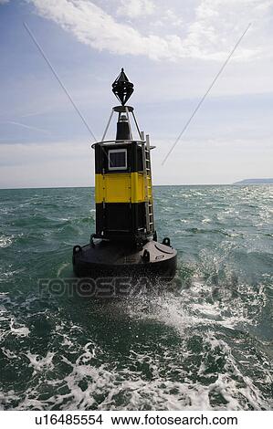 Wave splashing against buoy View Large Photo Image Picture - Wave splashing against buoy. Fotosearch
