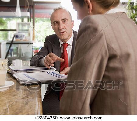 woman and man having discussion at bar View Large Photo Image Stock Image - woman and man having discussion at bar. Fotosearch