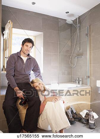 woman and man in chalet bathroom View Large Photo Image Stock Photography - woman and man in chalet bathroom. Fotosearch