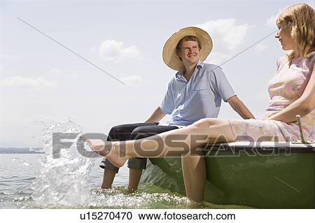 woman and man in rowing boat on lake View Large Photo Image Stock Image - woman and man in rowing boat on lake. Fotosearch