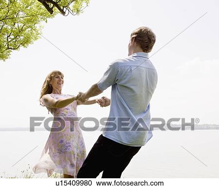 woman and man spinning at lake View Large Photo Image Stock Image - woman and man spinning at lake. Fotosearch