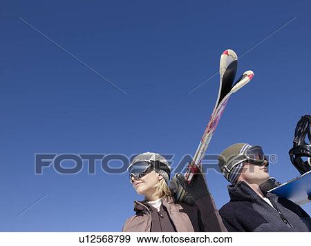 woman and man with ski and snowboard View Large Photo Image Stock Photo - woman and man with ski and snowboard. Fotosearch