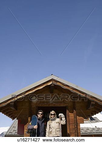 woman and man with ski gear at hut View Large Photo Image Stock Photo - woman and man with ski gear at hut. Fotosearch