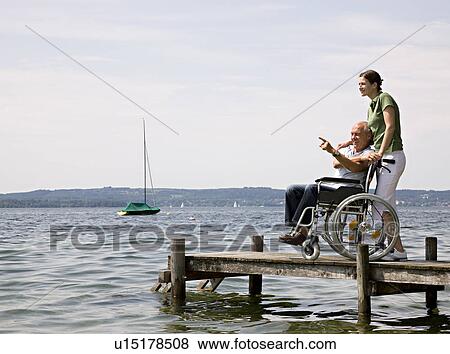 woman and senior man in wheelchair View Large Photo Image Stock Photo - woman and senior man in wheelchair. Fotosearch