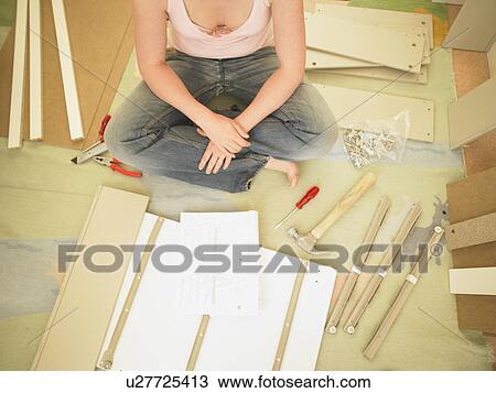 Woman building furniture View Large Photo Image Stock Image - Woman building furniture. Fotosearch