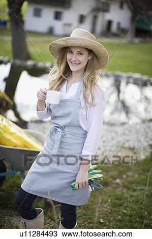 woman drinking coffee in garden View Large Photo Image Stock Image - woman drinking coffee in garden. Fotosearch