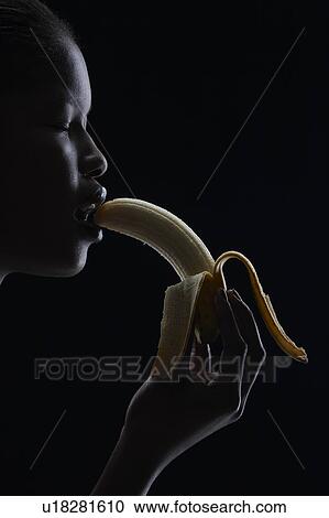 Woman eating banana View Large Photo Image Stock Image - Woman eating banana. Fotosearch