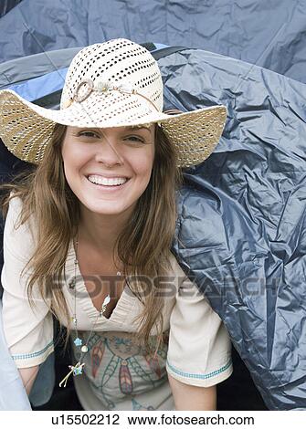 Woman emerging from tent View Large Photo Image Stock Image - Woman emerging from tent. Fotosearch