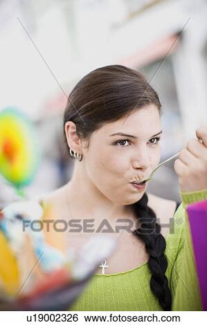 woman enjoying icecream View Large Photo Image Stock Photograph - woman enjoying icecream. Fotosearch