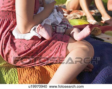 woman feeding baby outside View Large Photo Image Stock Image - woman feeding baby outside. Fotosearch