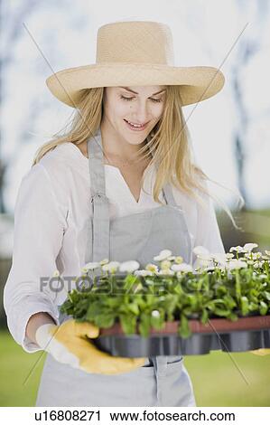Stock Image - woman gardening. Fotosearch