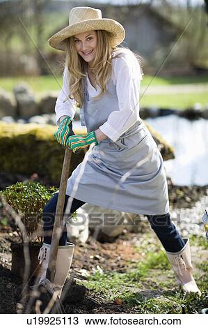 Stock Image - woman gardening. Fotosearch