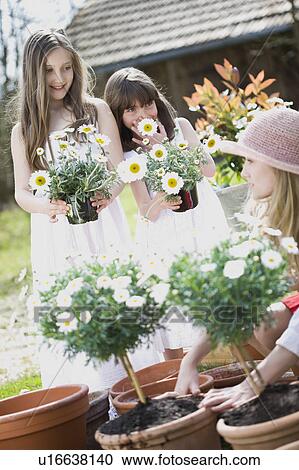 woman gardening with two children View Large Photo Image Stock Image - woman gardening with two children. Fotosearch