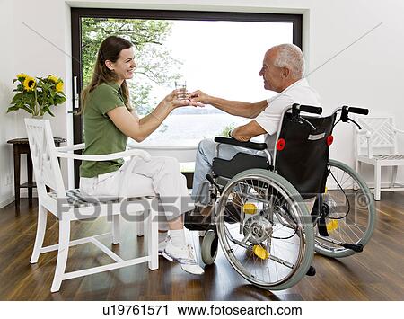 woman handing medicine to man View Large Photo Image Stock Image - woman handing medicine to man. Fotosearch