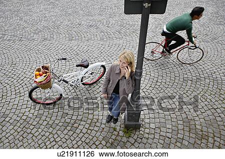 Stock Photograph - Woman having a break while shopping. Fotosearch