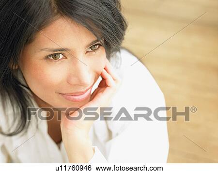 Stock Photograph - Woman having a day dream. Fotosearch