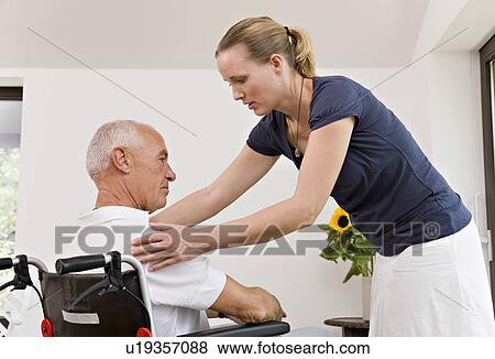woman helping senior man View Large Photo Image Stock Photo - woman helping senior man. Fotosearch