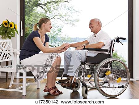 woman holding senior man's hand View Large Photo Image Stock Image - woman holding senior man's hand. Fotosearch