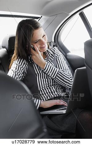woman in car on phone View Large Photo Image Stock Photo - woman in car on phone. Fotosearch
