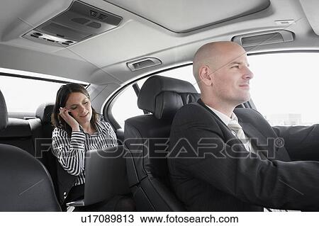woman in car on phone with driver View Large Photo Image Stock Image - woman in car on phone with driver. Fotosearch