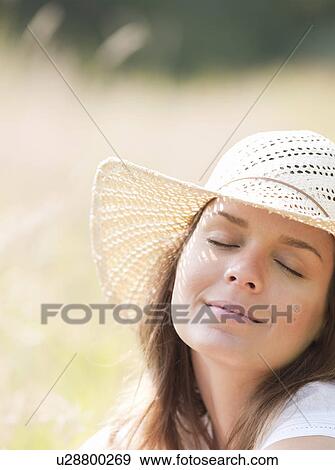 woman in hat smiling, eyes closed View Large Photo Image Stock Photo - woman in hat smiling, eyes closed. Fotosearch