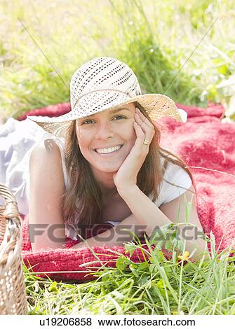 Stock Photo - woman in hat smiling. Fotosearch
